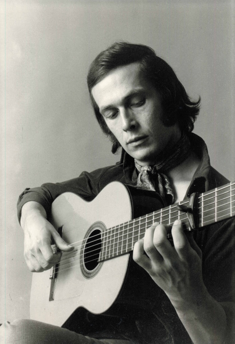 Paco de Lucía holding his flamenco guitar
